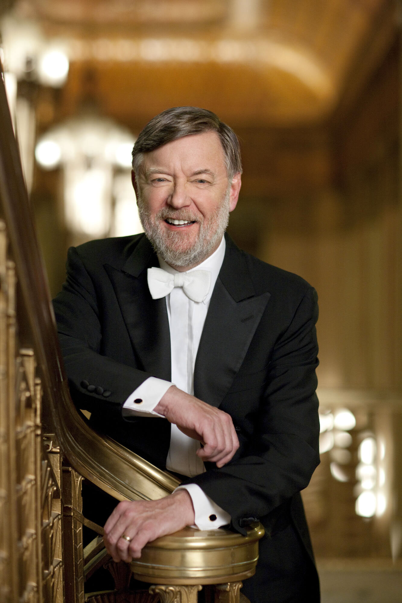 Sir Andrew Davis smiling in suit and white bowtie